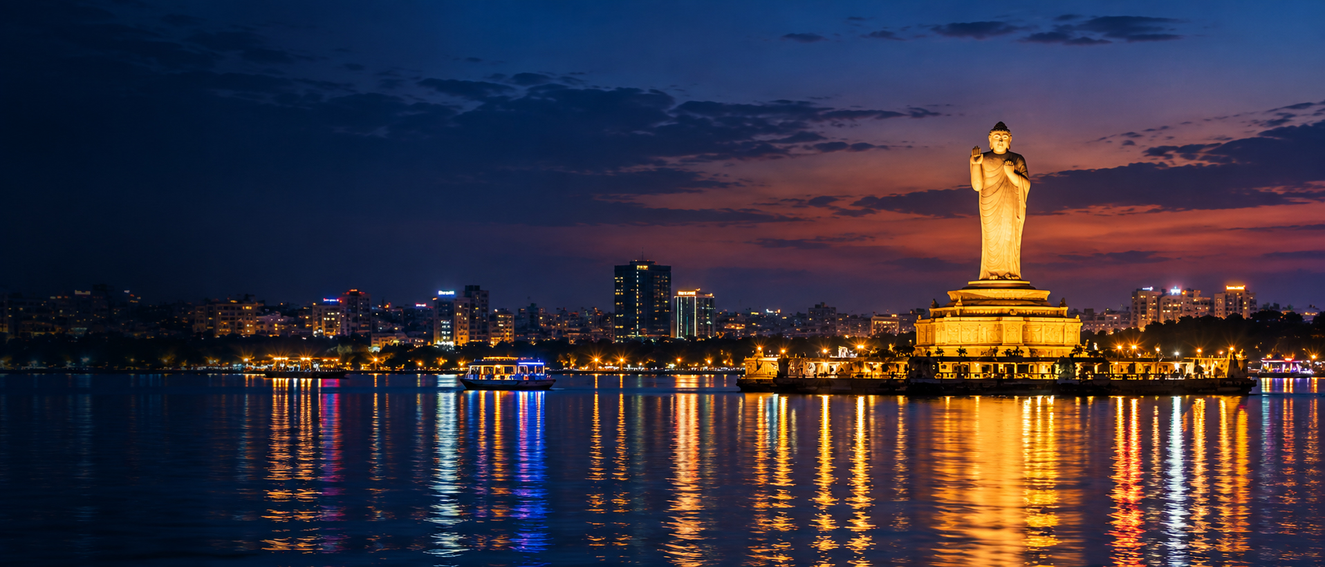 Buddha statue lit up on Hussain Sagar lake at night, Hyderabad